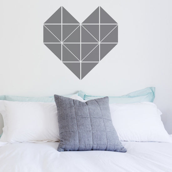 Geometric heart sticker above a double bed