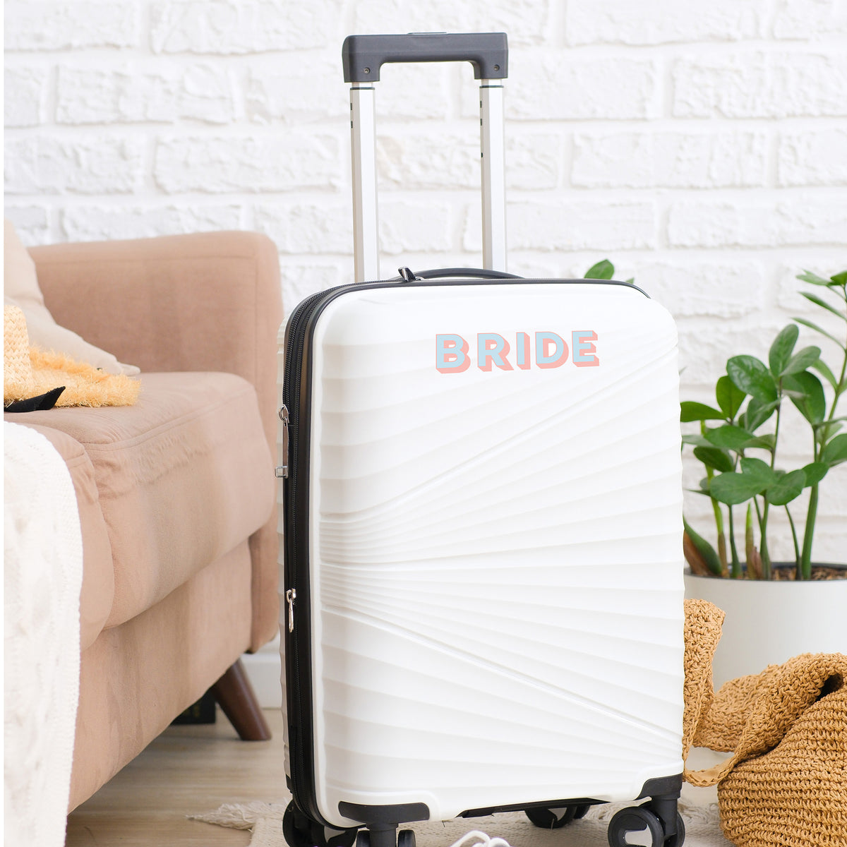 White suitcase with Personalised Luggage Sticker in the name of &