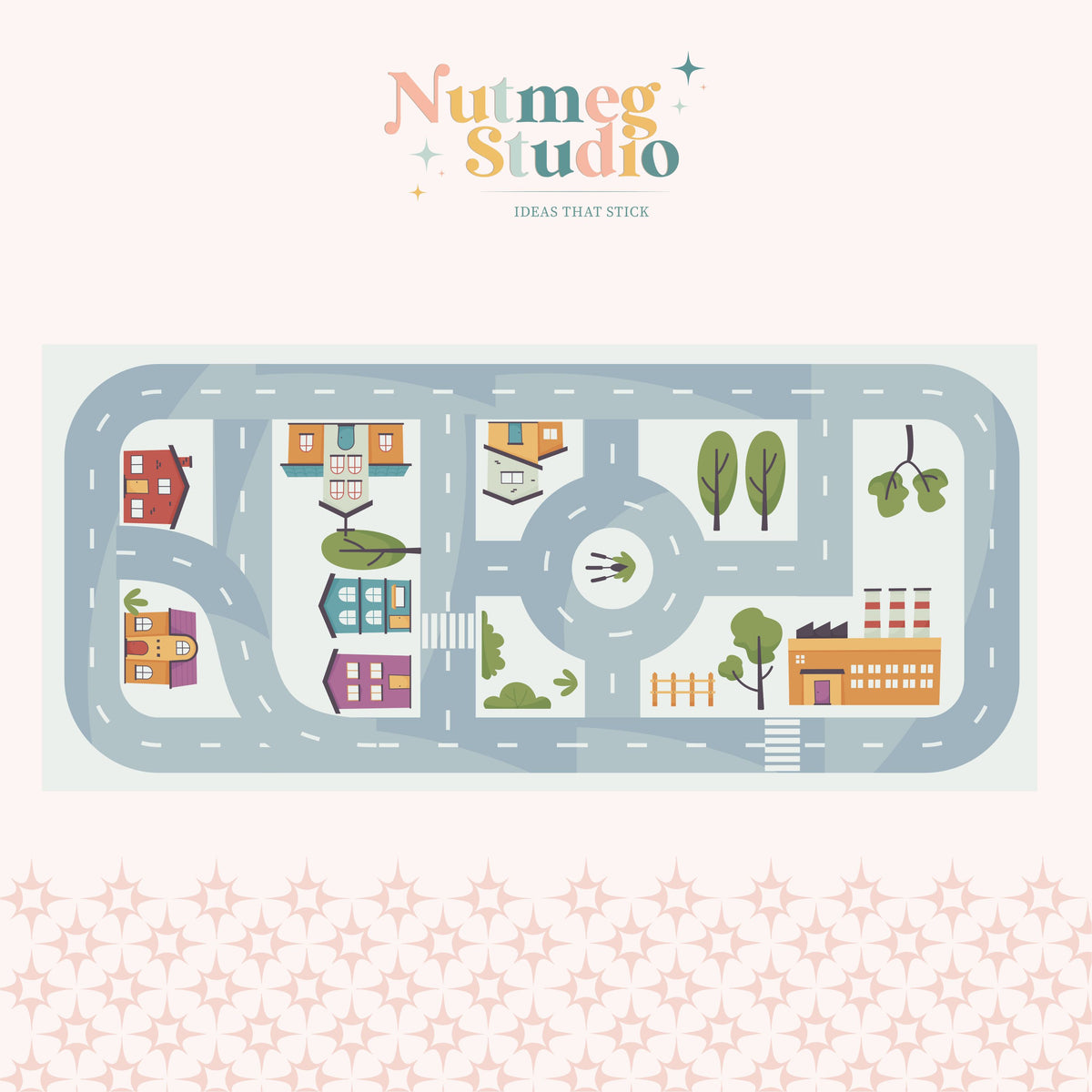 sample of road play map showing colourful houses, tress and roads on a pink background.