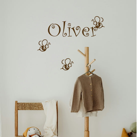 Custom baby name decal with bee design on wall
