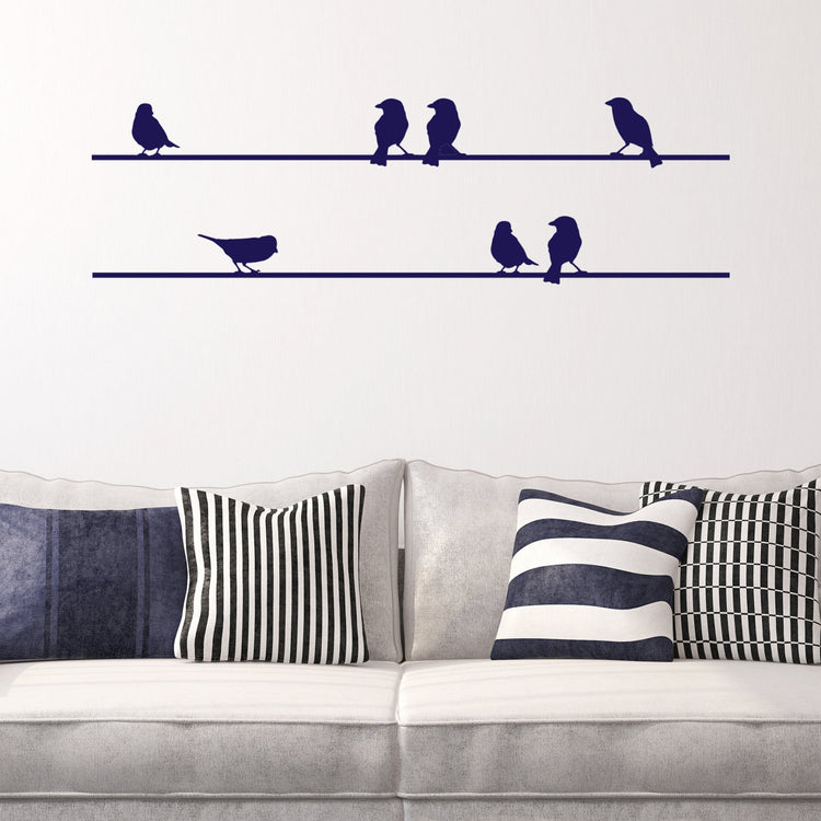 Birds on a Wire Wall Sticker. Perfect vinyl for decorating a home. Shown in a navy blue vinyl on a white wall.  