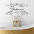 Bathroom Wall Sticker Quote. Word bathroom written in a script style font, with decoration above and below word. shown in brown vinyl on white wall.