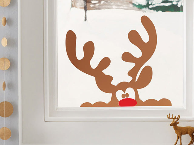 Sticker of Rudolph Peeking through a Window.