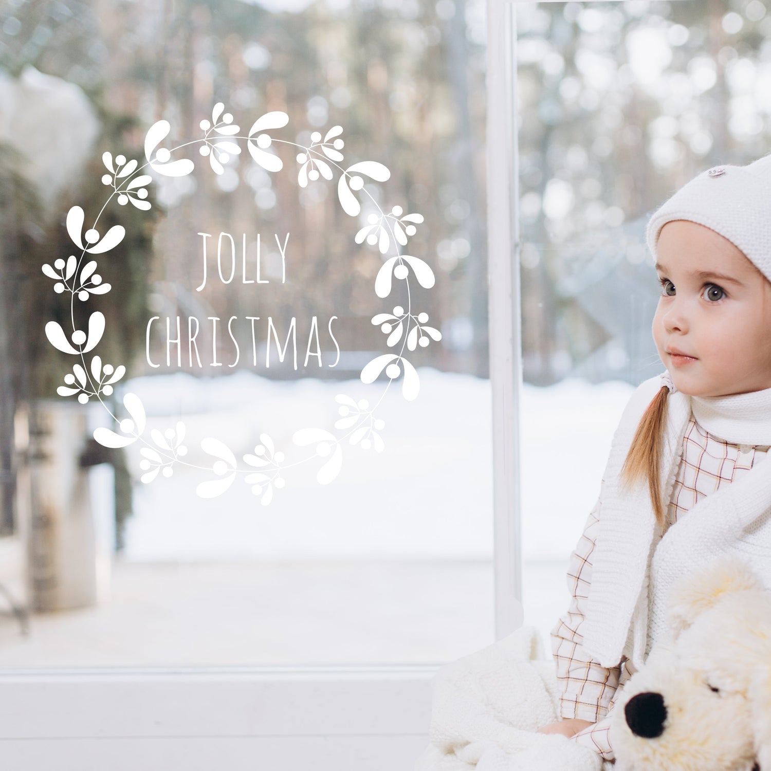 Christmas Window Stickers against a white christmas scene