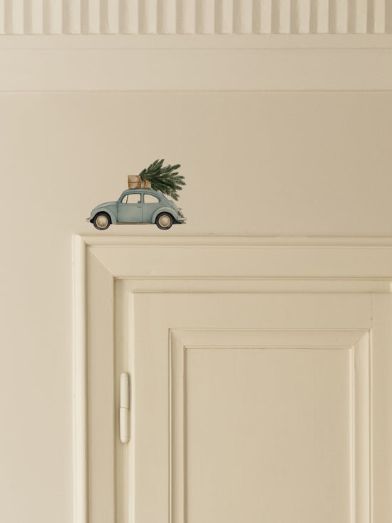 Blue Car Carrying a Christmas Tree Door Decoration