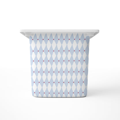 A large rectangular storage bin, featuring a light blue and white harlequin diamond pattern with small red dots, shown on a clean white background.