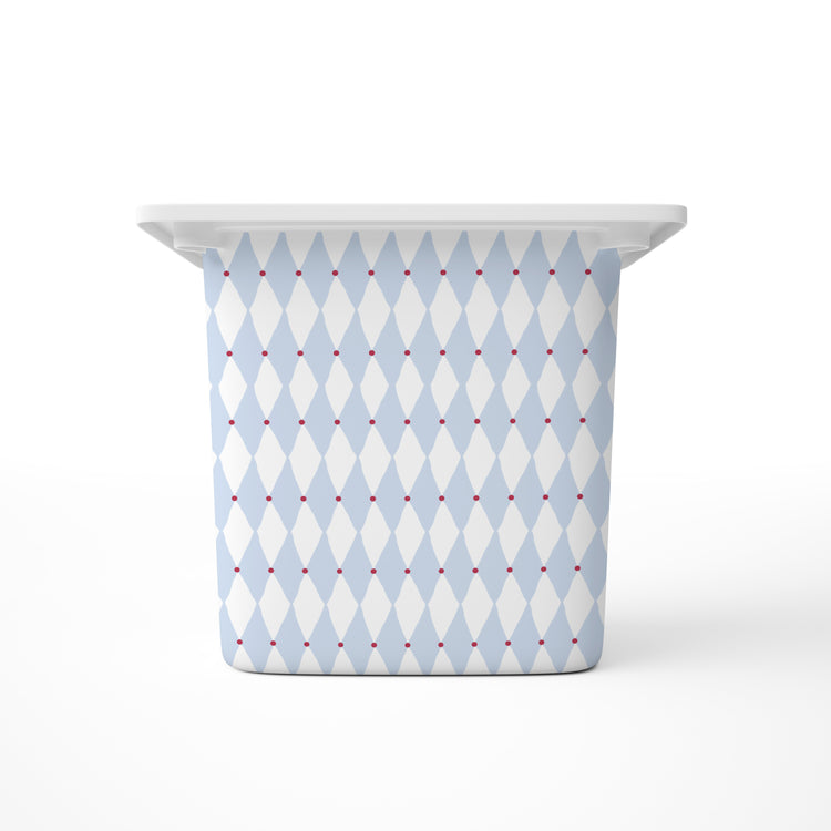 A large rectangular storage bin, featuring a light blue and white harlequin diamond pattern with small red dots, shown on a clean white background.