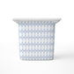 A large rectangular storage bin, featuring a light blue and white harlequin diamond pattern with small red dots, shown on a clean white background.
