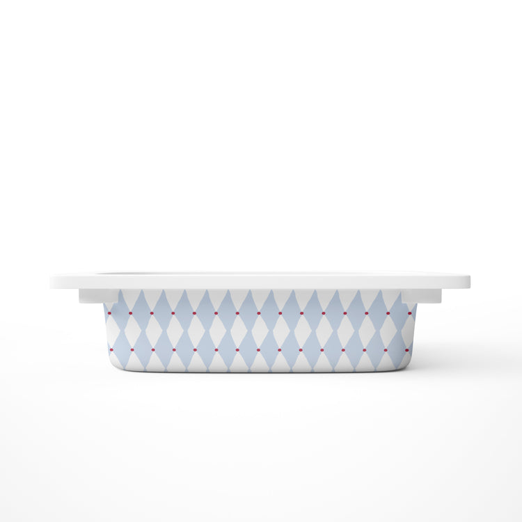 A small rectangular storage bin, featuring a light blue and white harlequin diamond pattern with small red dots, shown on a clean white background.
