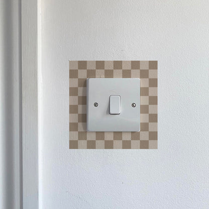 Brown &amp; Cream Chequred_Light_Switch_Decals on a white wall