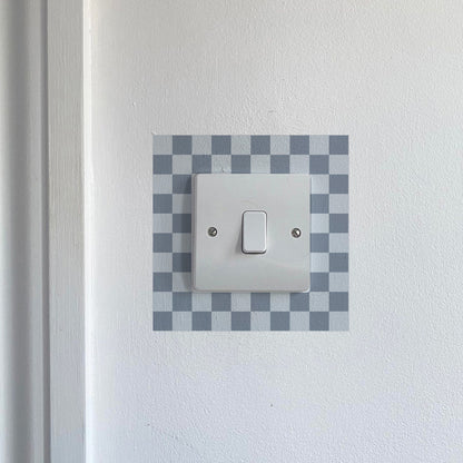 Dark &amp; Light Blue Chequred_Light_Switch_Decals on a white wall