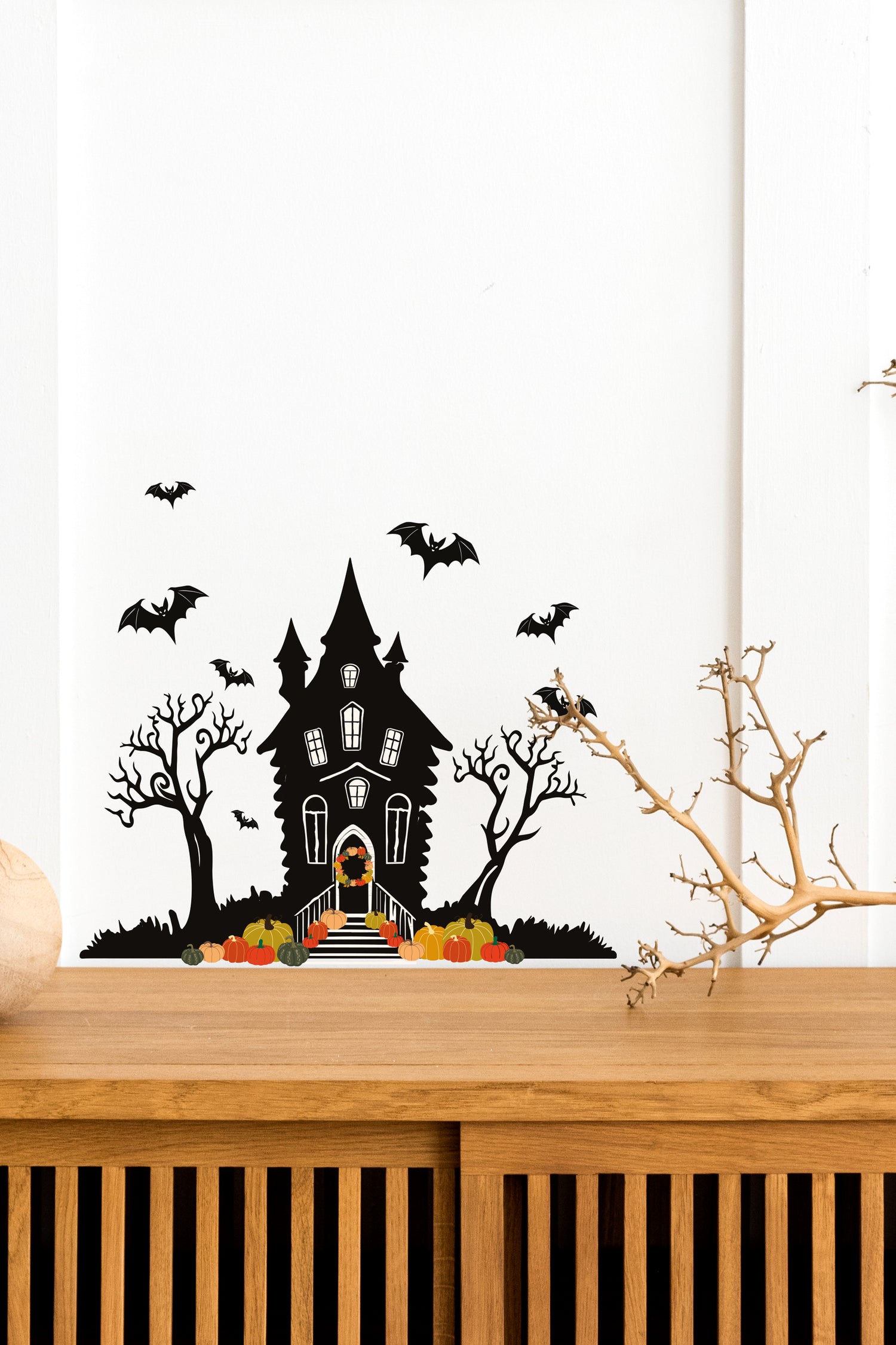 Halloween_Spooky_Haunted_House_Wall_Sticker_Decal placed above a wooden table