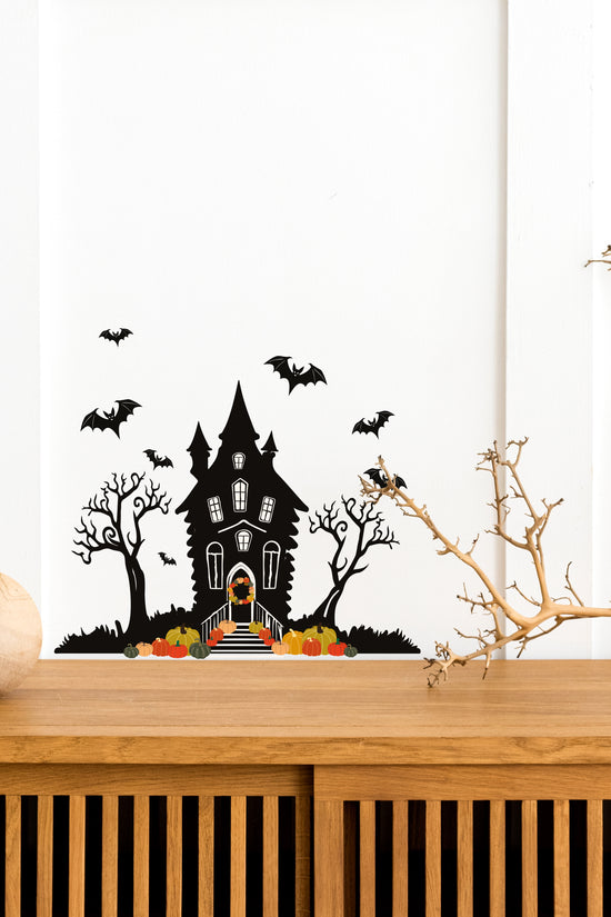 Halloween_Spooky_Haunted_House_Wall_Sticker_Decal placed above a wooden table