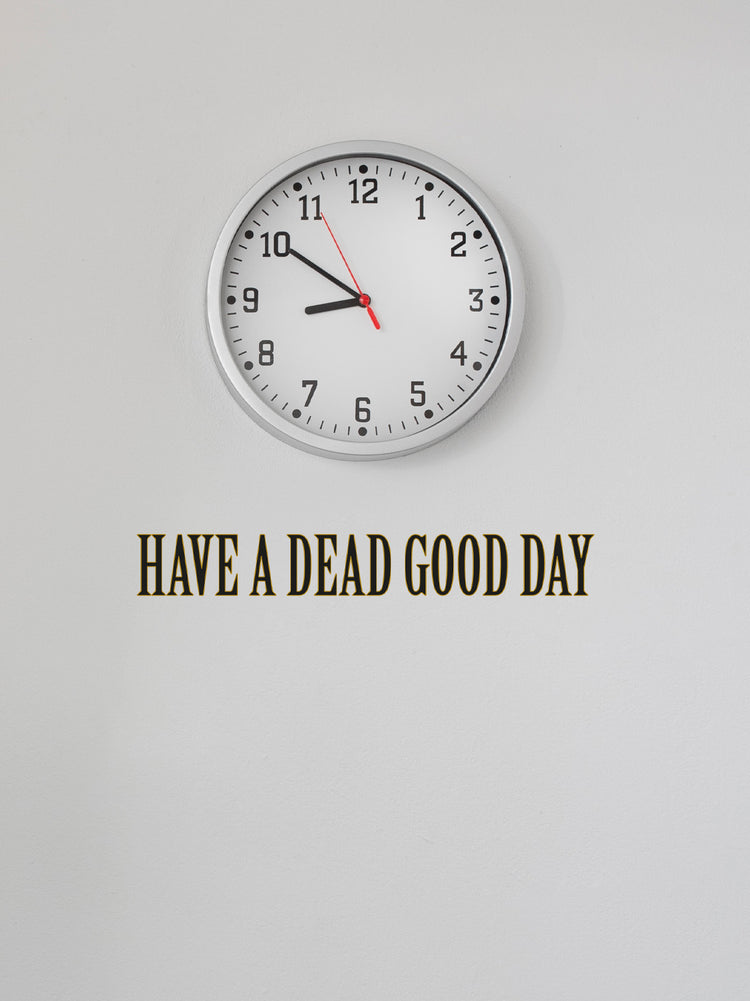 Clock on a white wall with text &