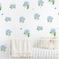 Nursery room with white crib and blue hydrangea wall decals with butterflies on a white background