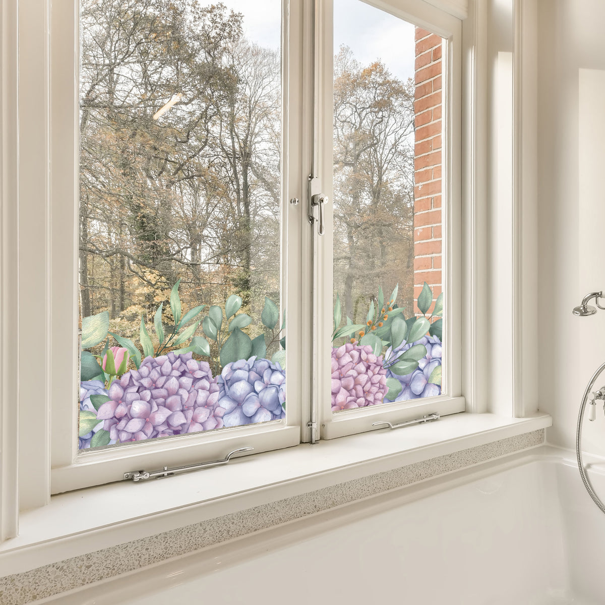 Bathroom window with Hydrangea Window Sticker and trees in the background