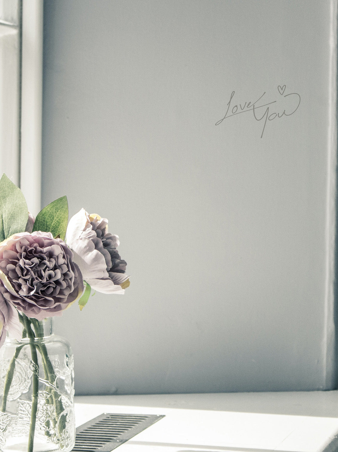 Floral arrangement in a vase with &