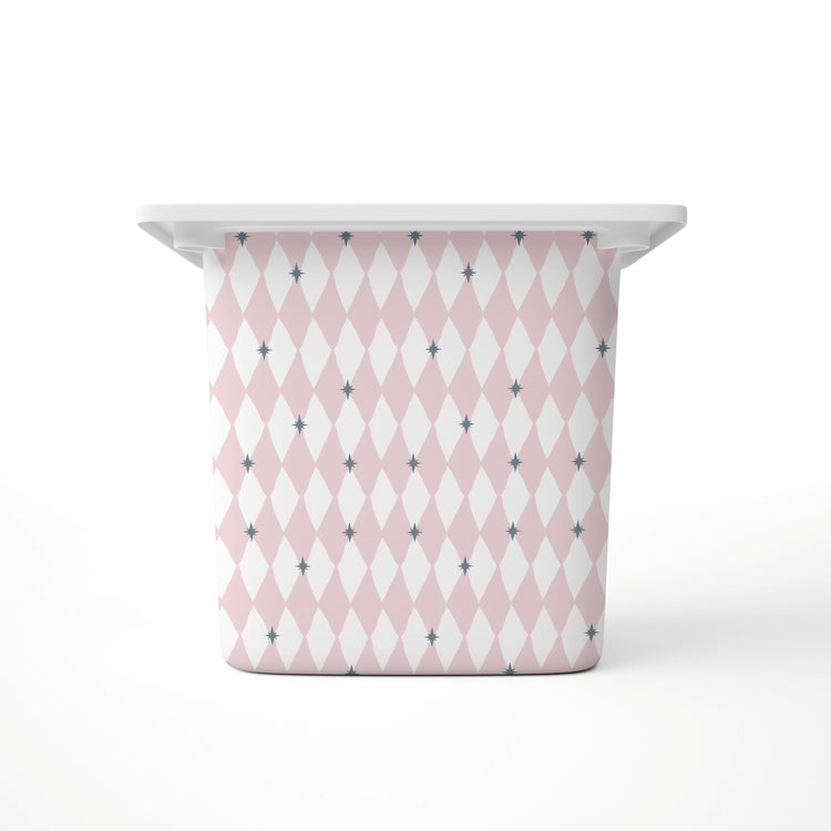 A Large rectangular storage bin, featuring a pink and white harlequin diamond pattern with small blue star accents, shown on a clean white background.