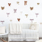 Nursery room with white crib and Mixed bow wall stickers