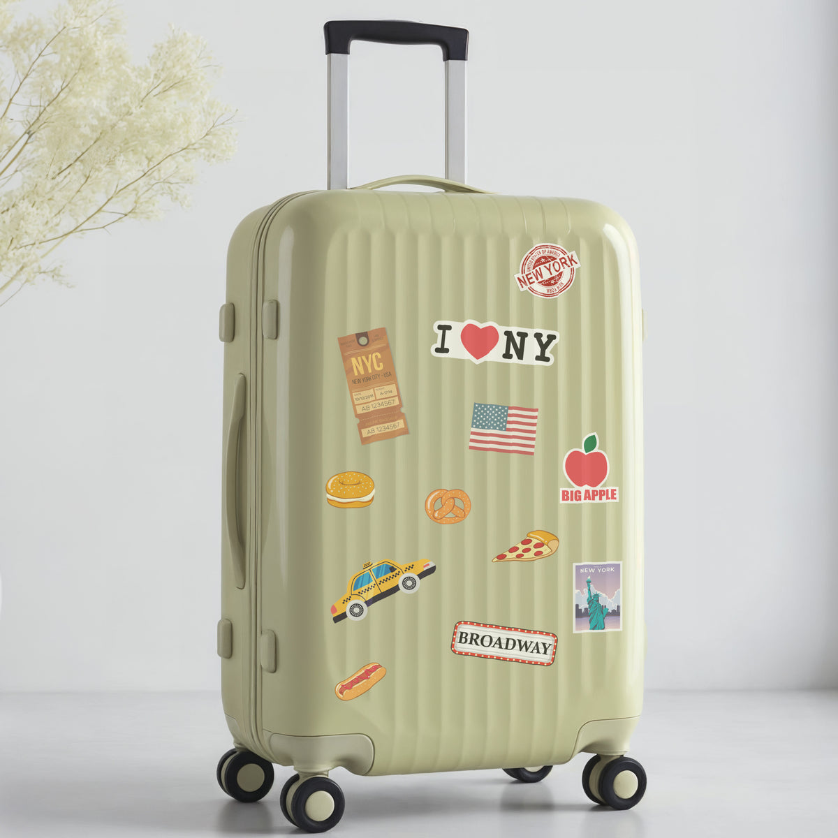 Green suitcase with New York travel-themed stickers on a light gray background