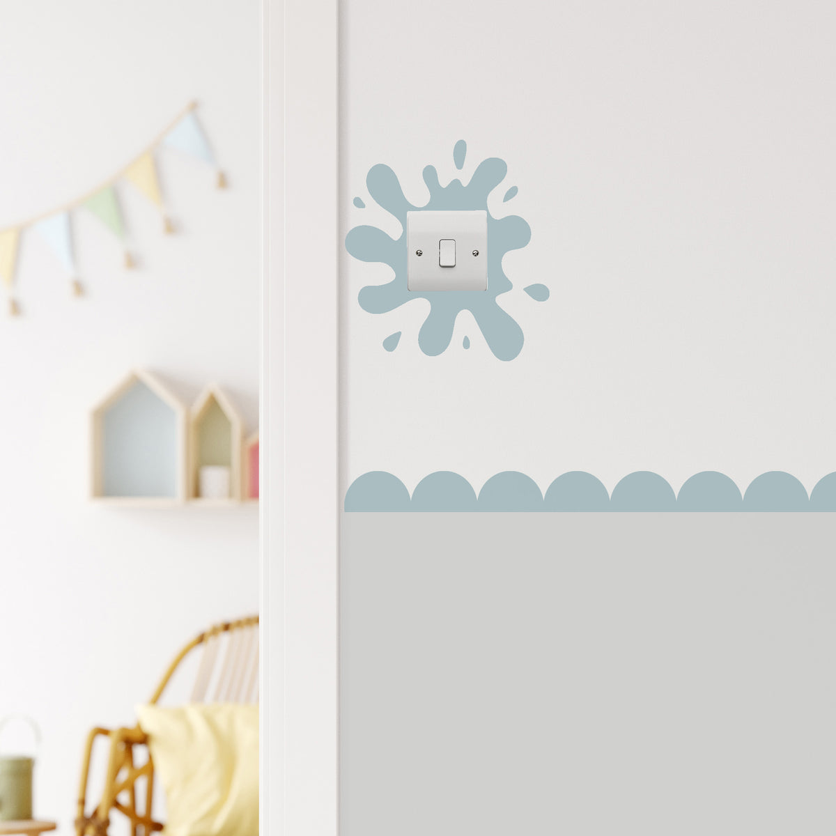 Paint Splat Light Switch in the colour swimming pool and an abstract design on a white wall.