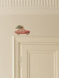 Red Car Carrying a Christmas Tree Door Decoration