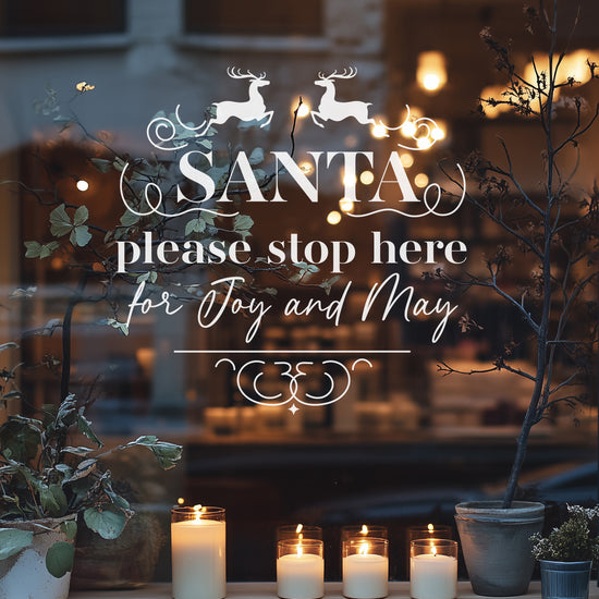 A festive window decal with white text reading &