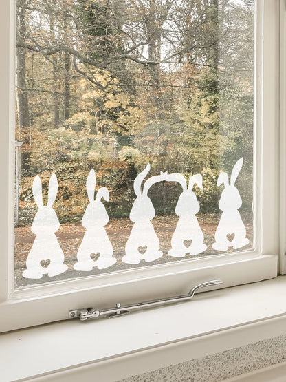 Set of 5 Easter Bunny Window Stickers in a window with trees behind 