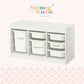 White plastic drawer organizer with three columns of bins labeled Large, Medium, and Small, shown on a pale pink background with the Nutmeg Studio logo at the top.