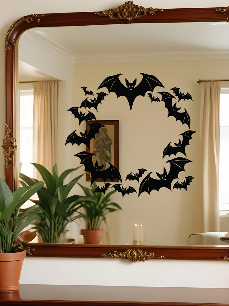 Decorative wall sticker of bats on a mirror with a room reflection.