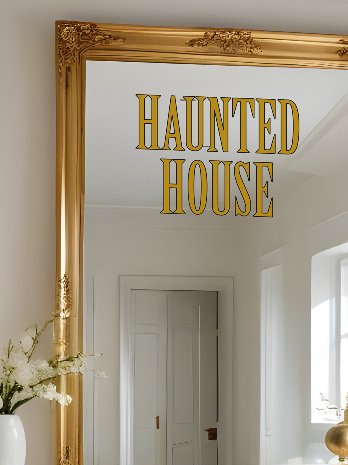 Gold-framed mirror with &