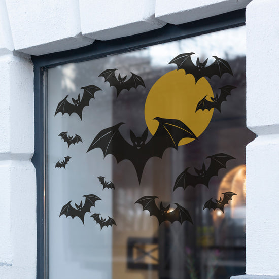 Bat flying in front of the moon Halloween window sticker