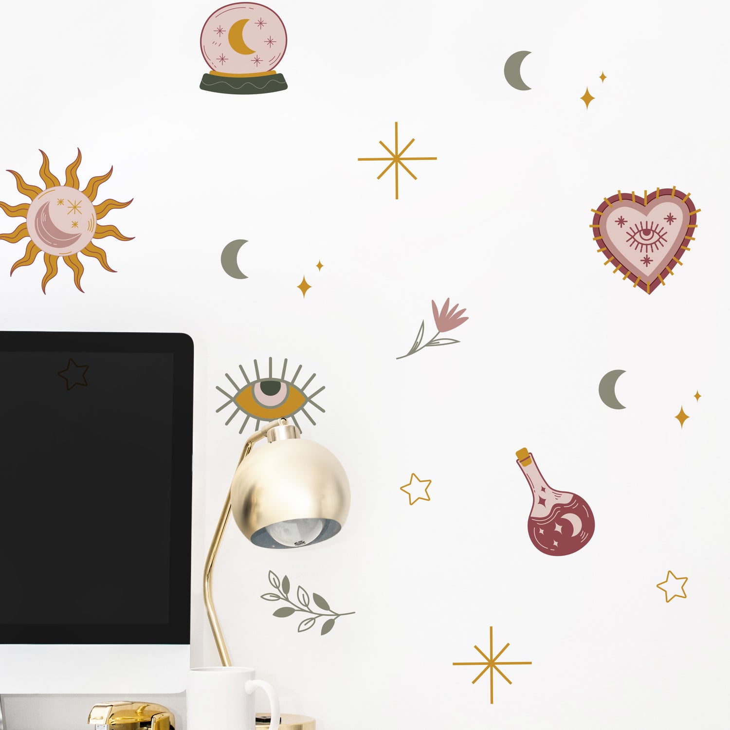 Decorative wall stickers with celestial and mystical designs on a white wall.