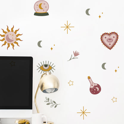 Decorative wall stickers with celestial and mystical designs on a white wall.
