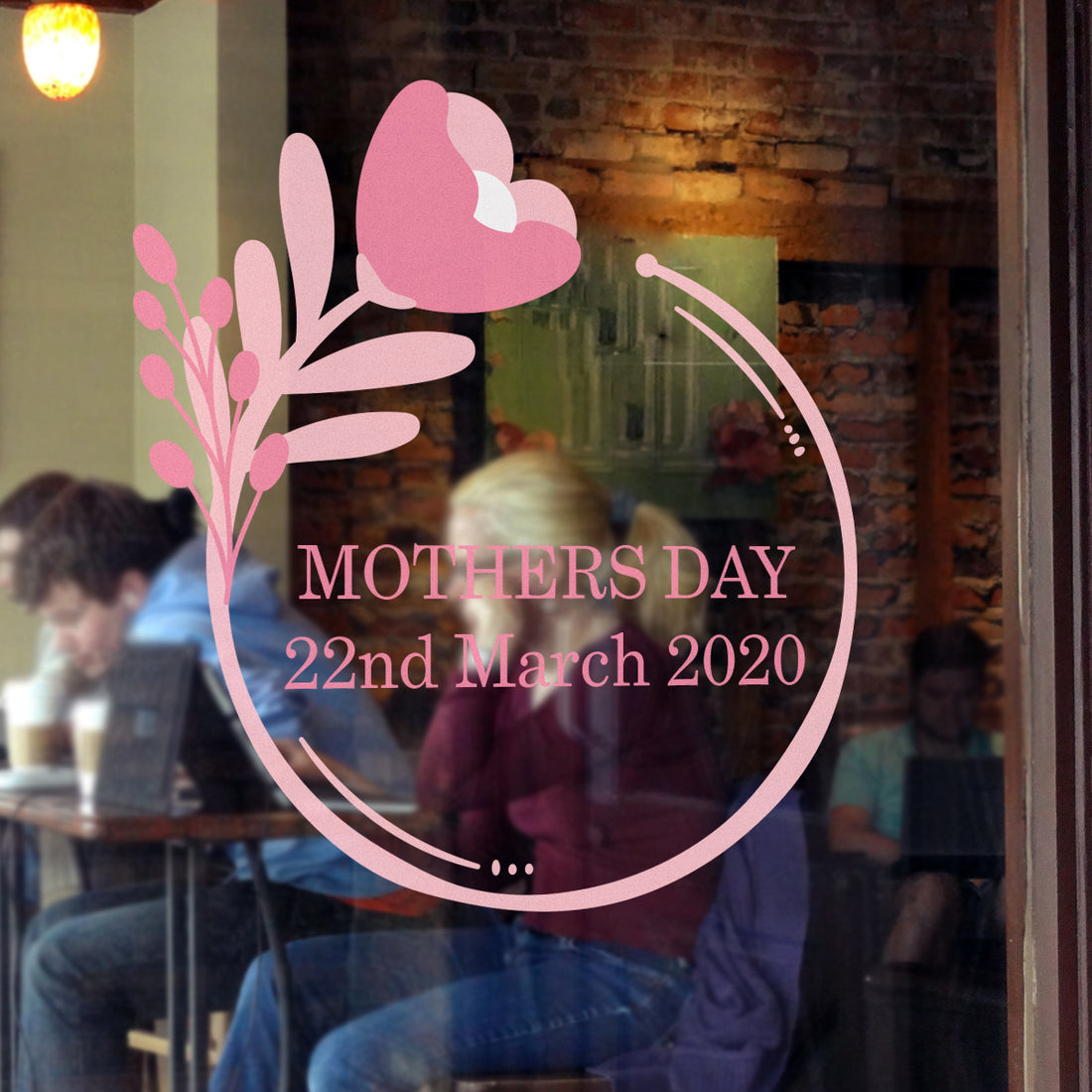 A retail shop window sticker vinyl with a floral circle design and the text &