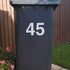 Bin Street Number or Name Sticker used to identify which bin is yours.  Shows a white vinyl on a black bin.