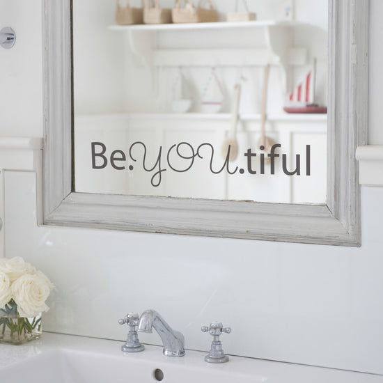 Be.You.tiful Mirror Sticker Quote. Shows a dark grey vinyl sticker on a mirror. Perfect for bathrooms, bedrooms and home decor. 