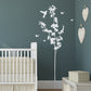 Blossom Tree Wall Sticker. Image shows the sticker in white vinyl on a dark green wall, the sticker includes the blossom tree, butterflies and a bird sticker. Perfect for decorating bedrooms or living rooms. 