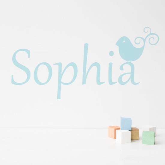Birdie Personalised wall Sticker, perfect for a nursery, playroom or bedroom. Includes the personalised name vinyl sticker and the bird sticker. Shown in light blue vinyl on a white wall. 